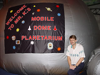 Paul Krupinski in front of the Mobile Dome Planetarium